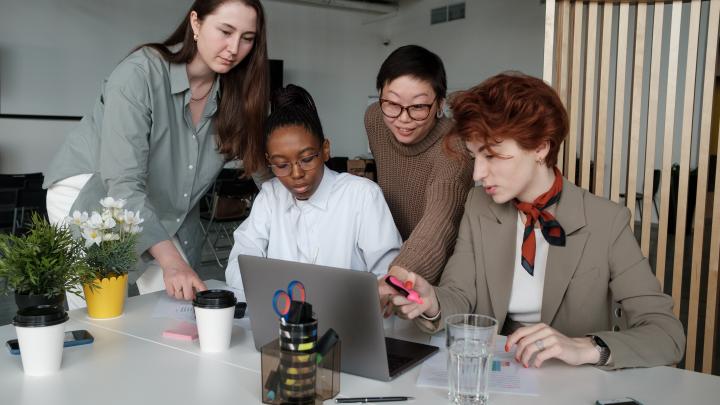 ECI Careers - Colleagues looking at a laptop